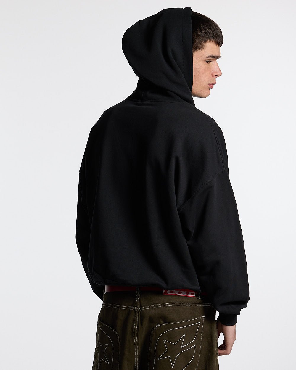 ESSENTIAL HOODIE BLACK - black oversized hoodie, back view on male model - Cold Culture
