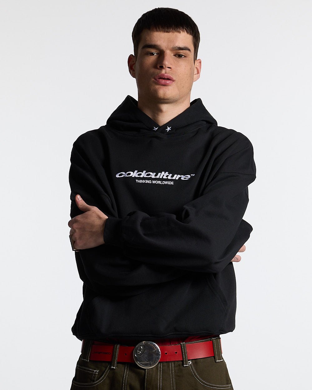 ESSENTIAL HOODIE BLACK - black oversized hoodie, front view on male model - Cold Culture #man