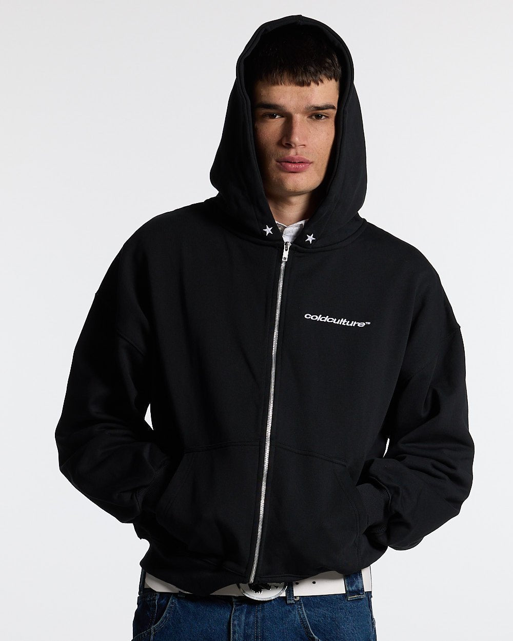 ESSENTIAL ZIP HOODIE BLACK - black zip-up hoodie, front view on male model - Cold Culture #man