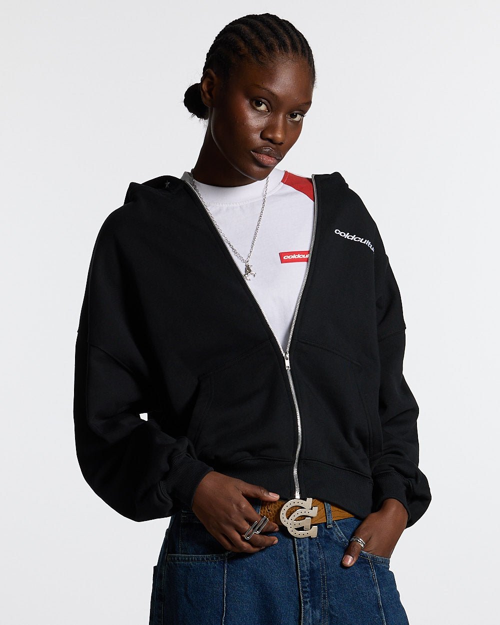 ESSENTIAL ZIP HOODIE BLACK - black zip-up hoodie, front view on female model - Cold Culture #woman