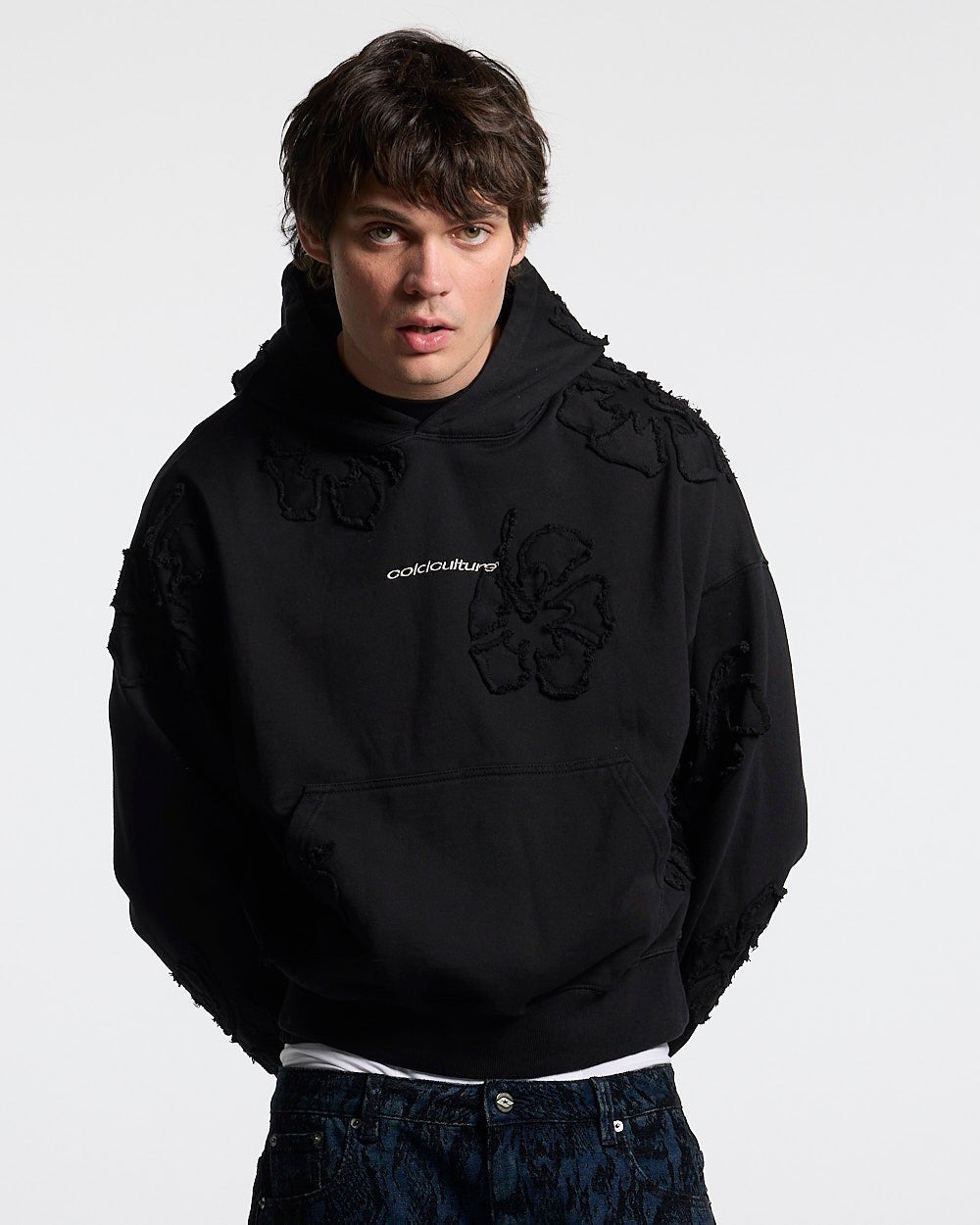 FAKE LOVE HOODIE BLACK - black floral applique hoodie, front view on male model - Cold Culture #man