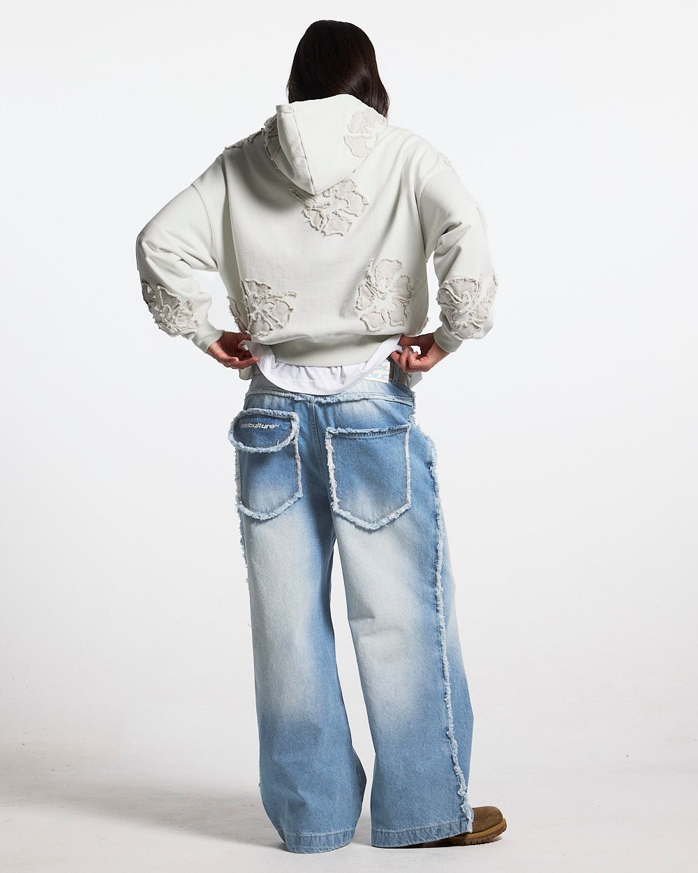 FAKE LOVE HOODIE GREY - light grey floral applique hoodie, back view on female model - Cold Culture #woman