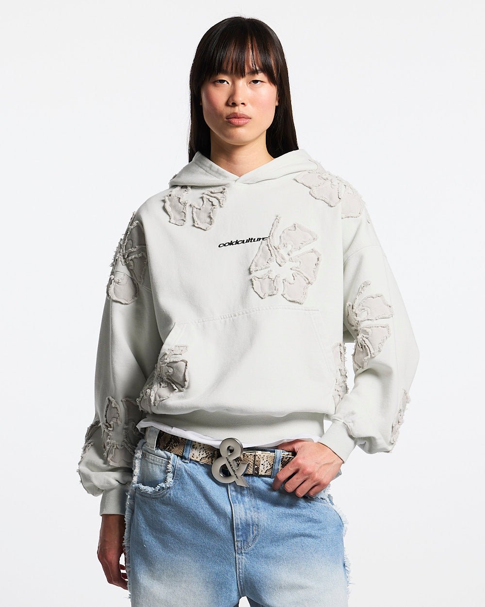 FAKE LOVE HOODIE GREY - light grey floral applique hoodie, front view on female model - Cold Culture #woman