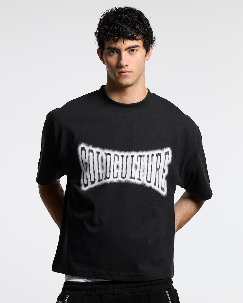 FEISTY TEE BLACK - black graphic print tee, front view on male model - Cold Culture #man