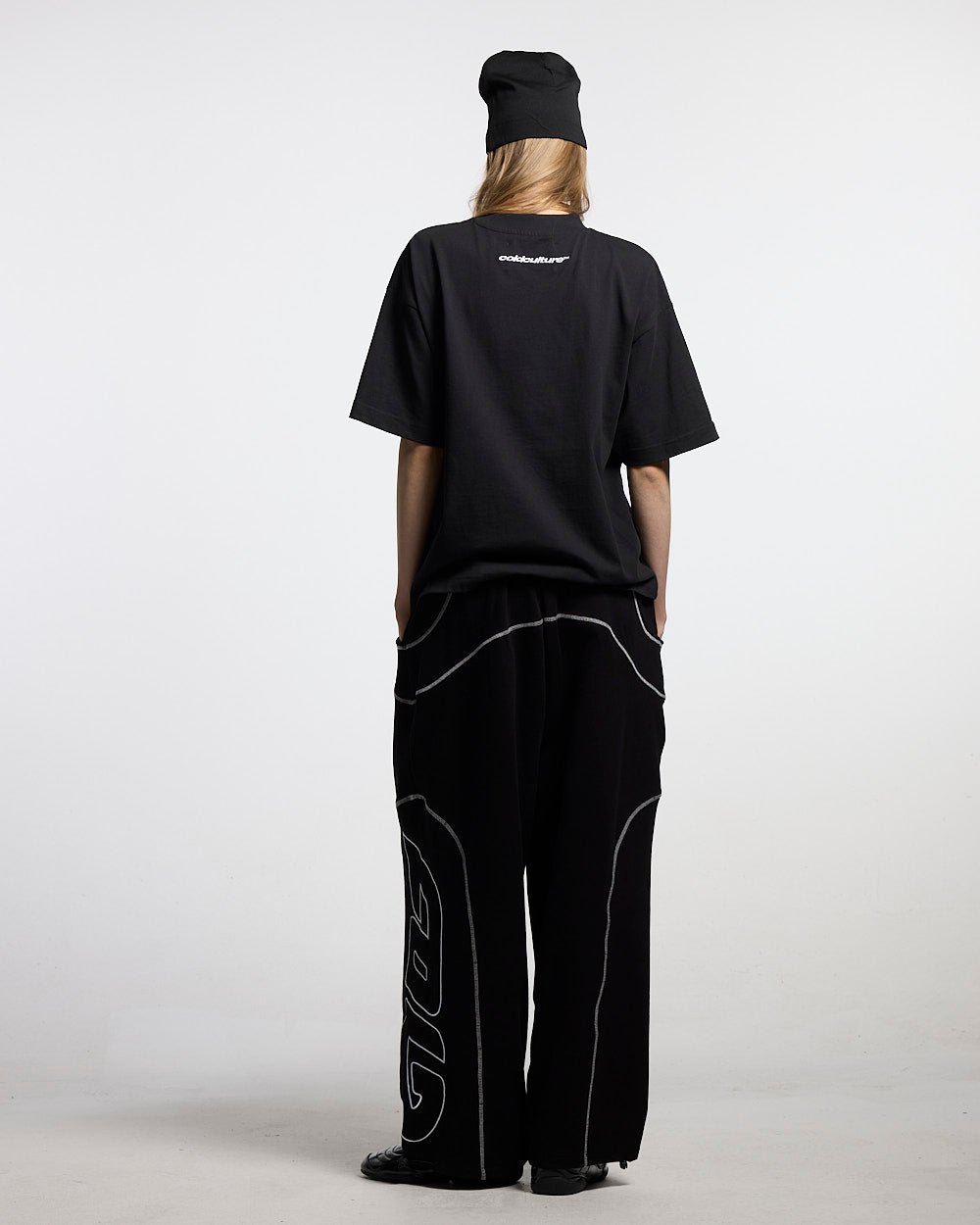 FEISTY TEE BLACK - black graphic print tee, back view on female model - Cold Culture #woman