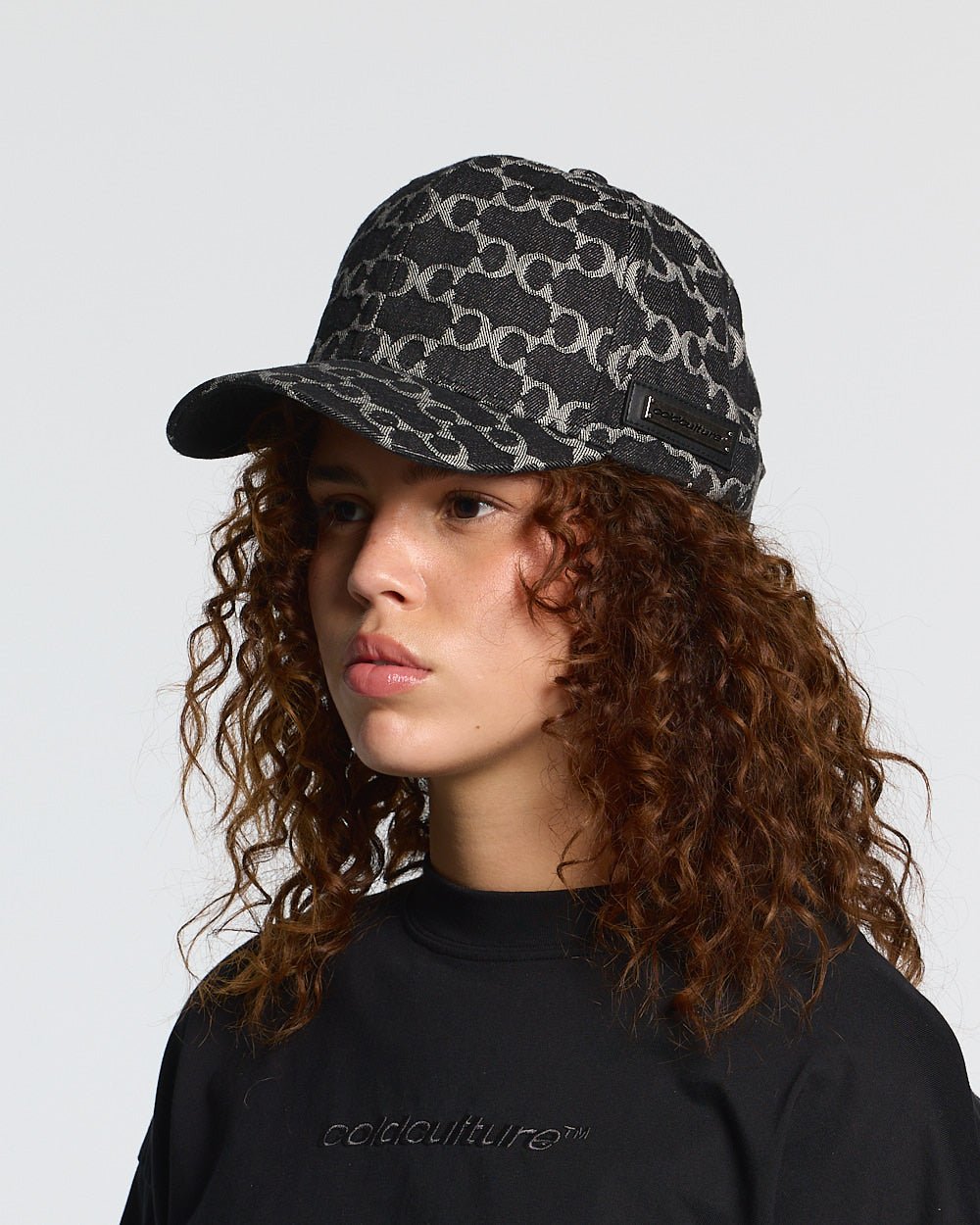 FEVER CAP BLACK - black monogram cap, on model close-up - Cold Culture #woman