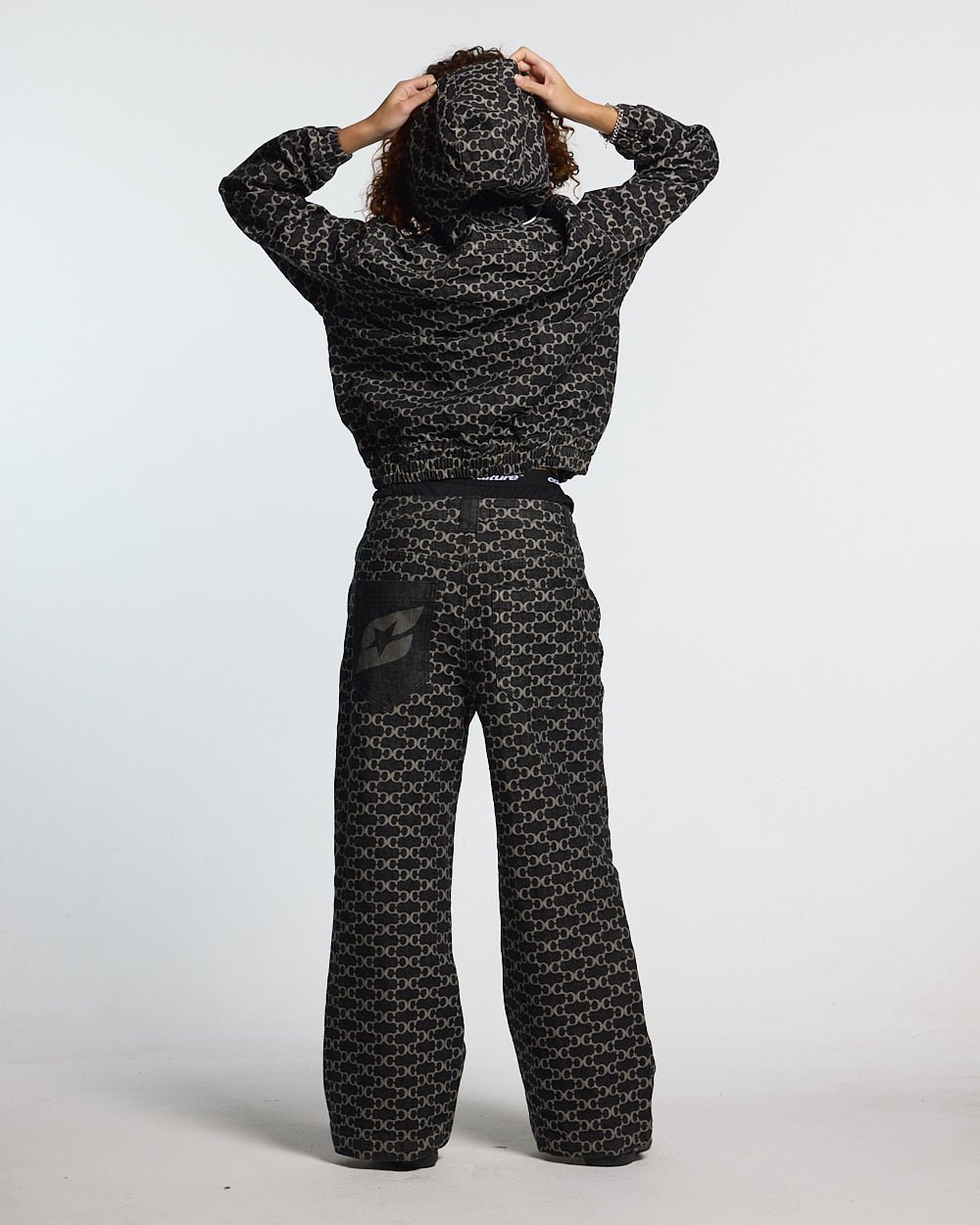 FEVER PANTS V3 BLACK - black monogram denim pants, back view on female model - Cold Culture #woman