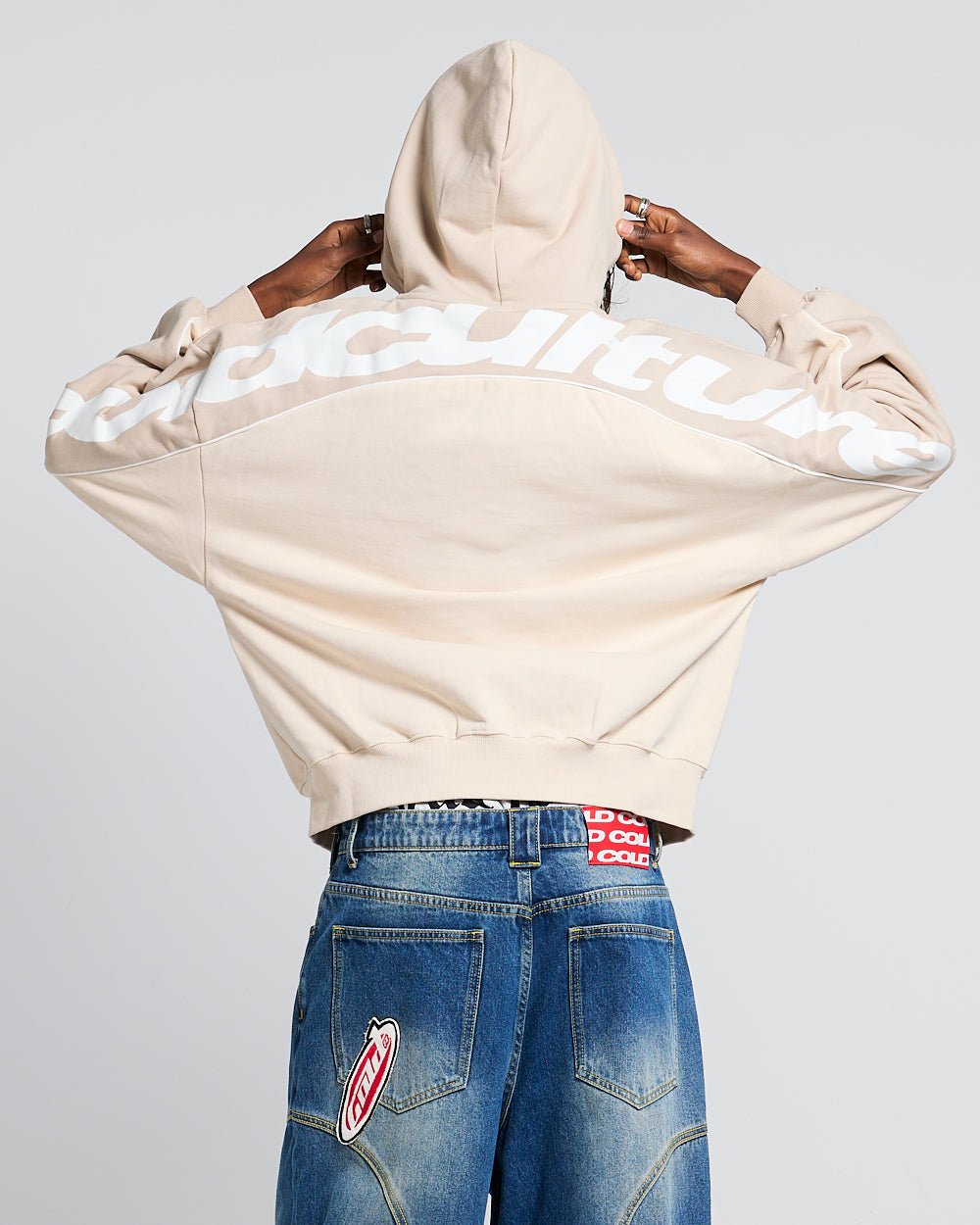 FLESH ZIP HOODIE BEIGE - beige zip-up hoodie, back view on female model - Cold Culture #woman