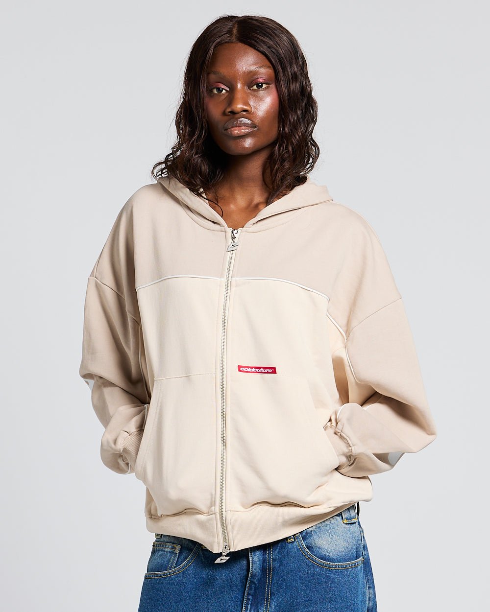 FLESH ZIP HOODIE BEIGE - beige zip-up hoodie, front view on female model - Cold Culture #woman
