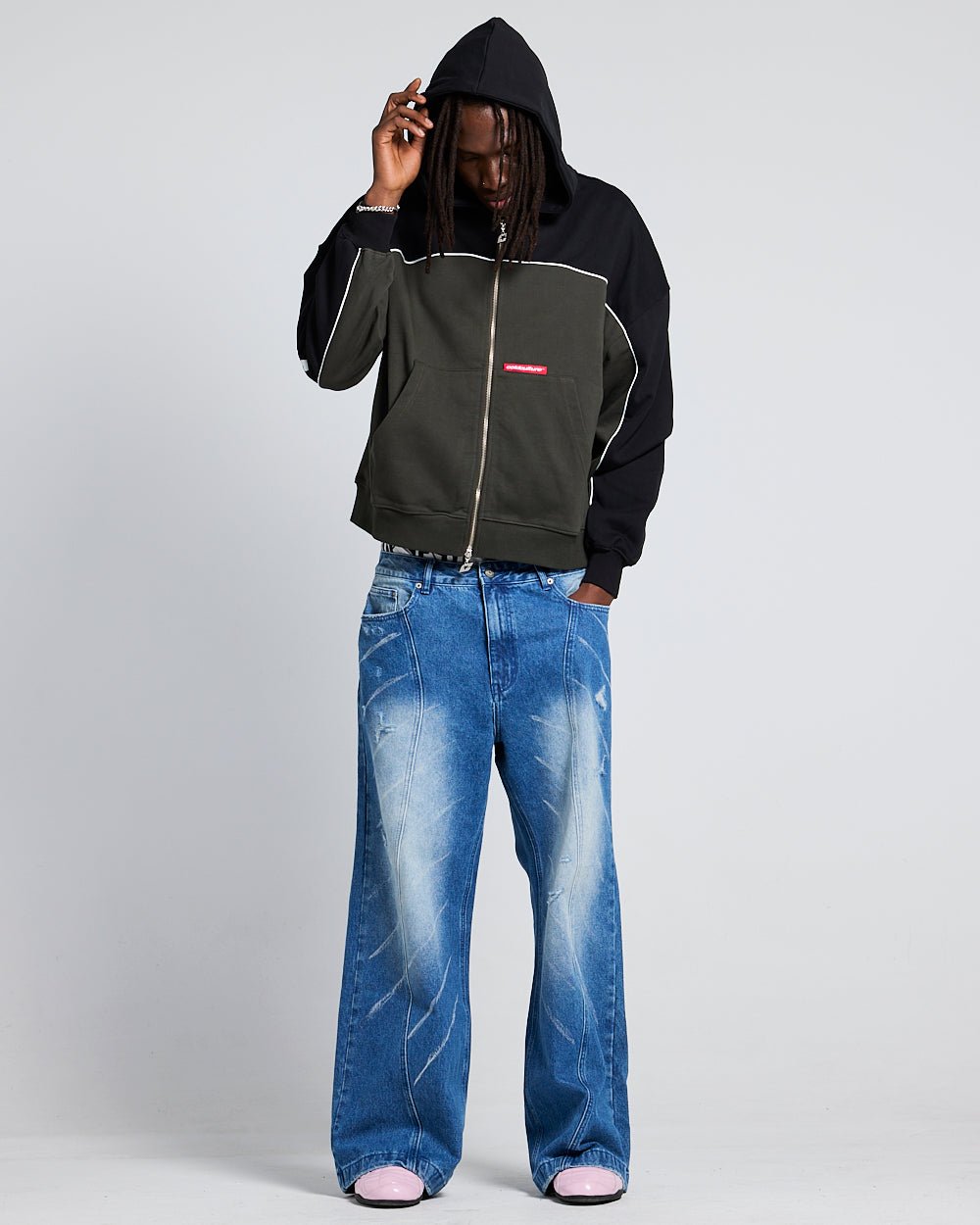FLESH ZIP HOODIE BLACK & GREY - black and grey zip-up hoodie, front view on male model - Cold Culture #man