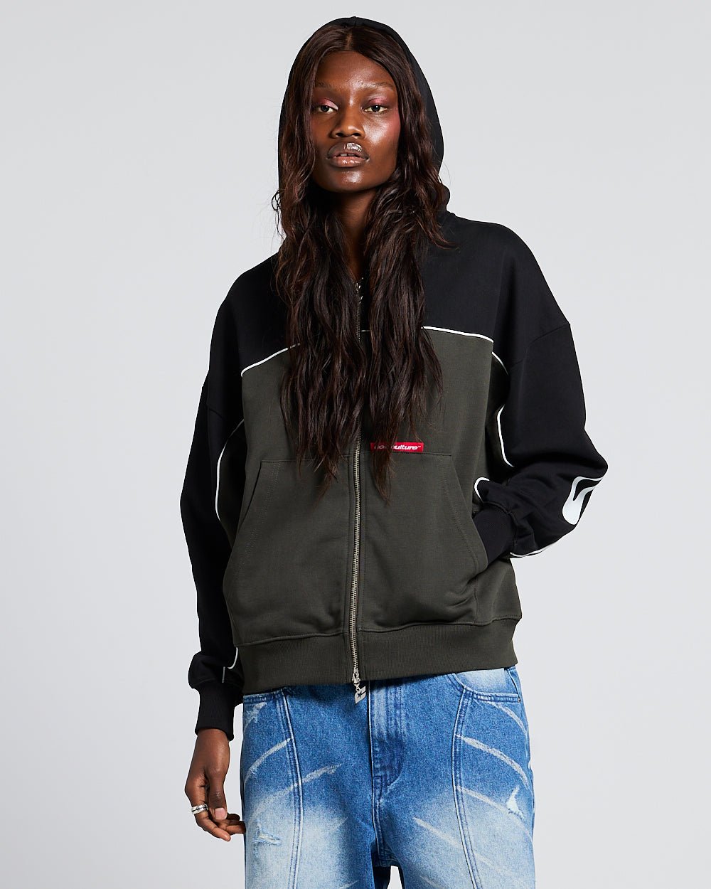 FLESH ZIP HOODIE BLACK & GREY - black and grey zip-up hoodie, front view on female model - Cold Culture #woman