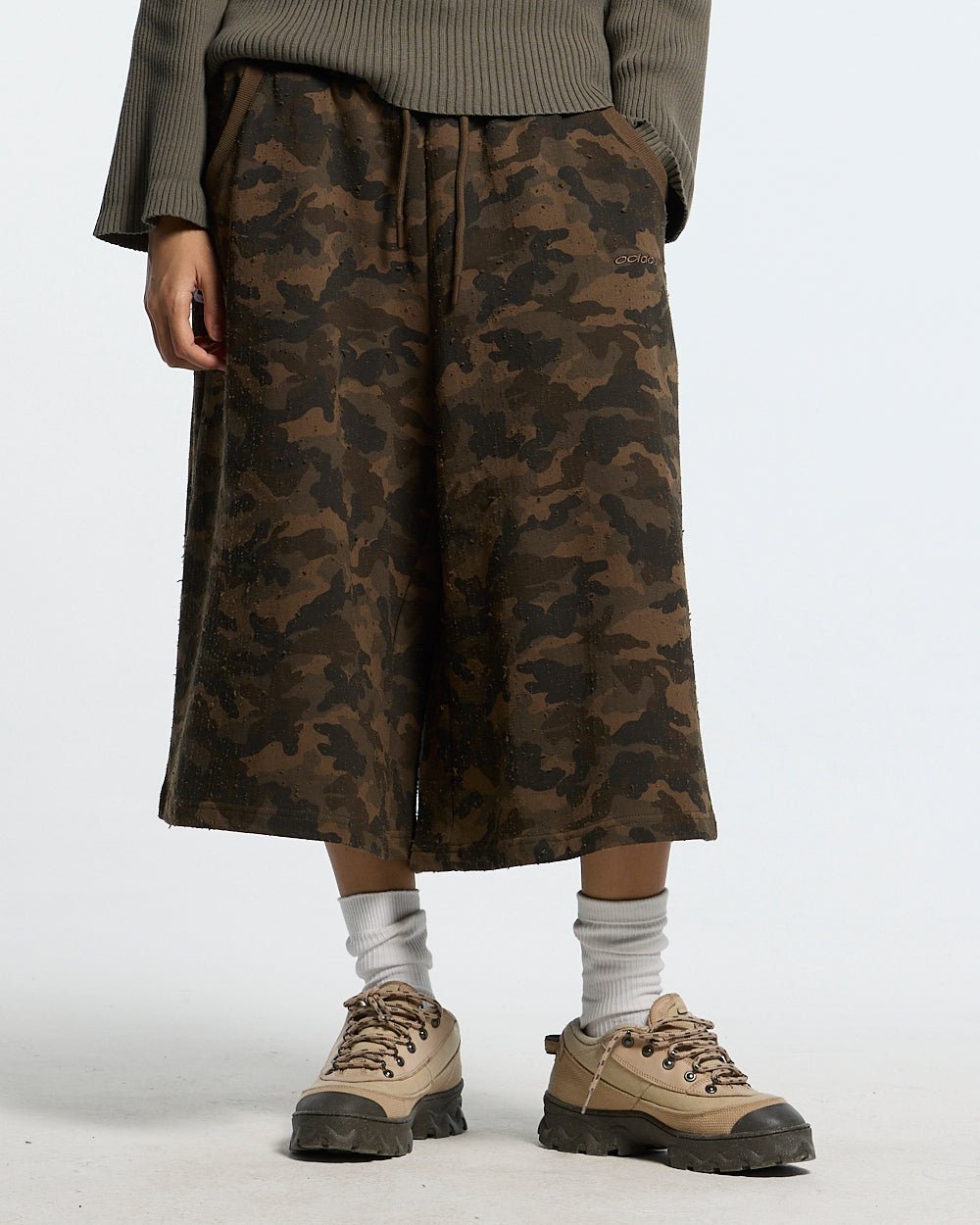 FRONT LINE JORTS GREEN - green camo shorts, front view on female model - Cold Culture #woman