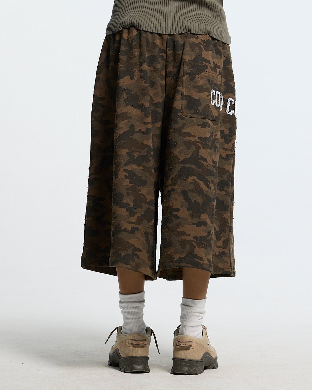 FRONT LINE JORTS GREEN - green camo shorts, back view on female model - Cold Culture #woman