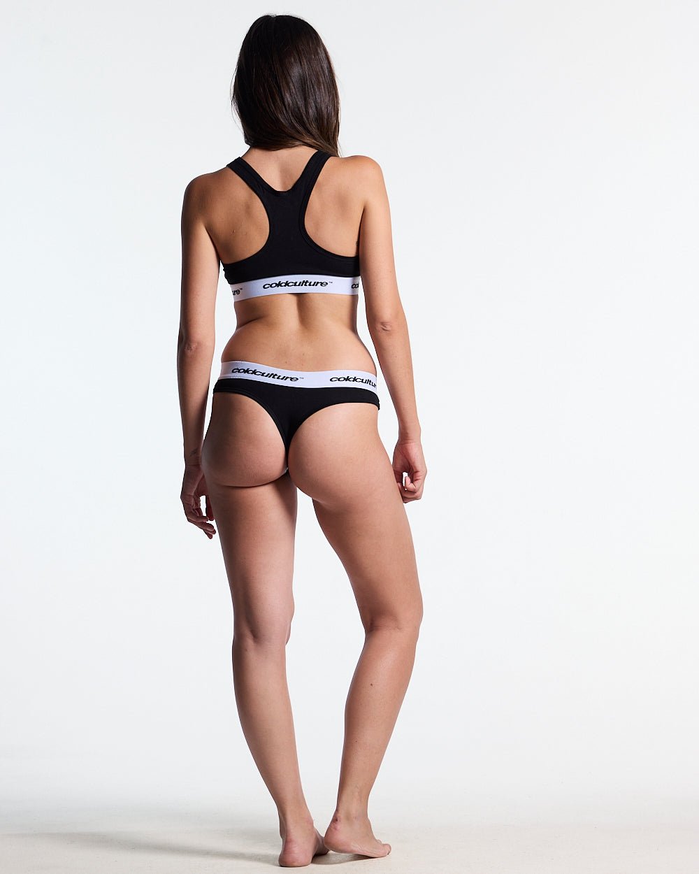 GIRLS CLUB THONG PACK BLACK - black thong two-pack, back view on female model - Cold Culture #woman