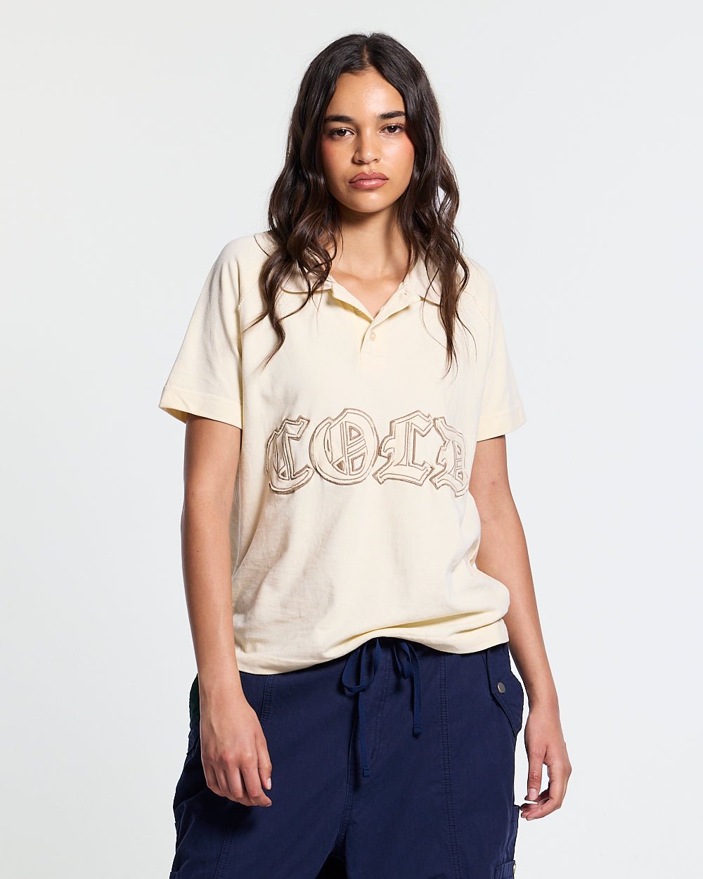 GOTHIC DISTRESSED POLO BEIGE - beige gothic print polo shirt, front view on female model - Cold Culture #woman