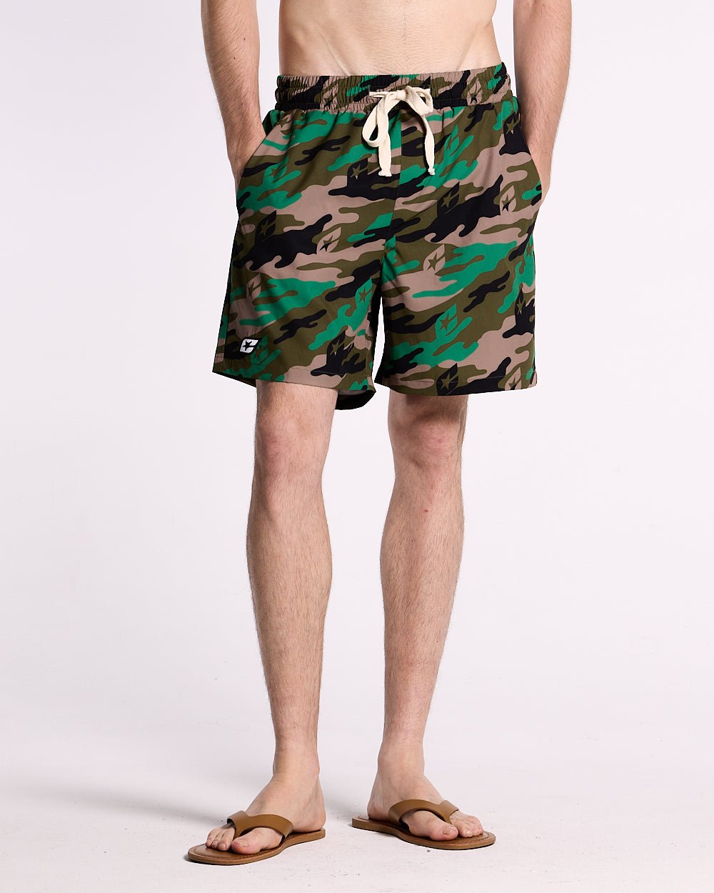 GREEN CAMO SWIM SHORT - green camo swim shorts, front view on male model - Cold Culture