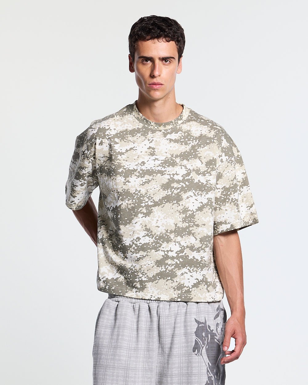GROUND CURVED TEE GREEN - green digital camo tee, front view on male model - Cold Culture #man
