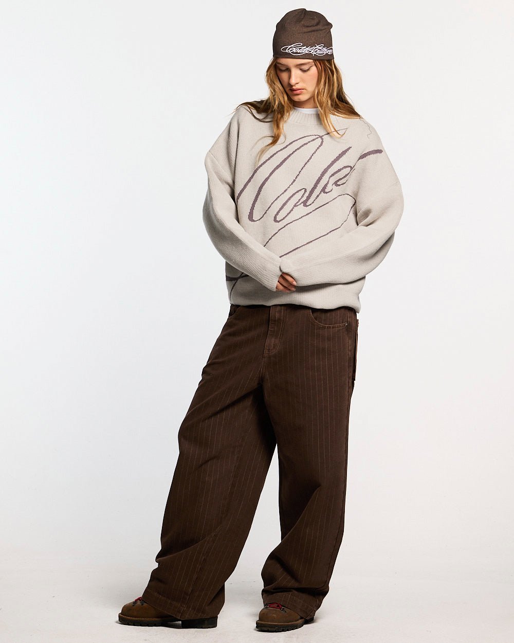 GRUBBY KNIT GREY - light grey script knit sweater, front view on female model - Cold Culture #woman