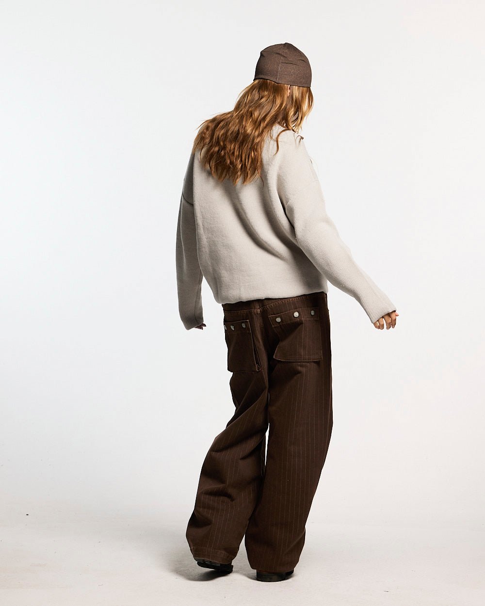 GRUBBY KNIT GREY - light grey script knit sweater, back view on female model - Cold Culture #woman