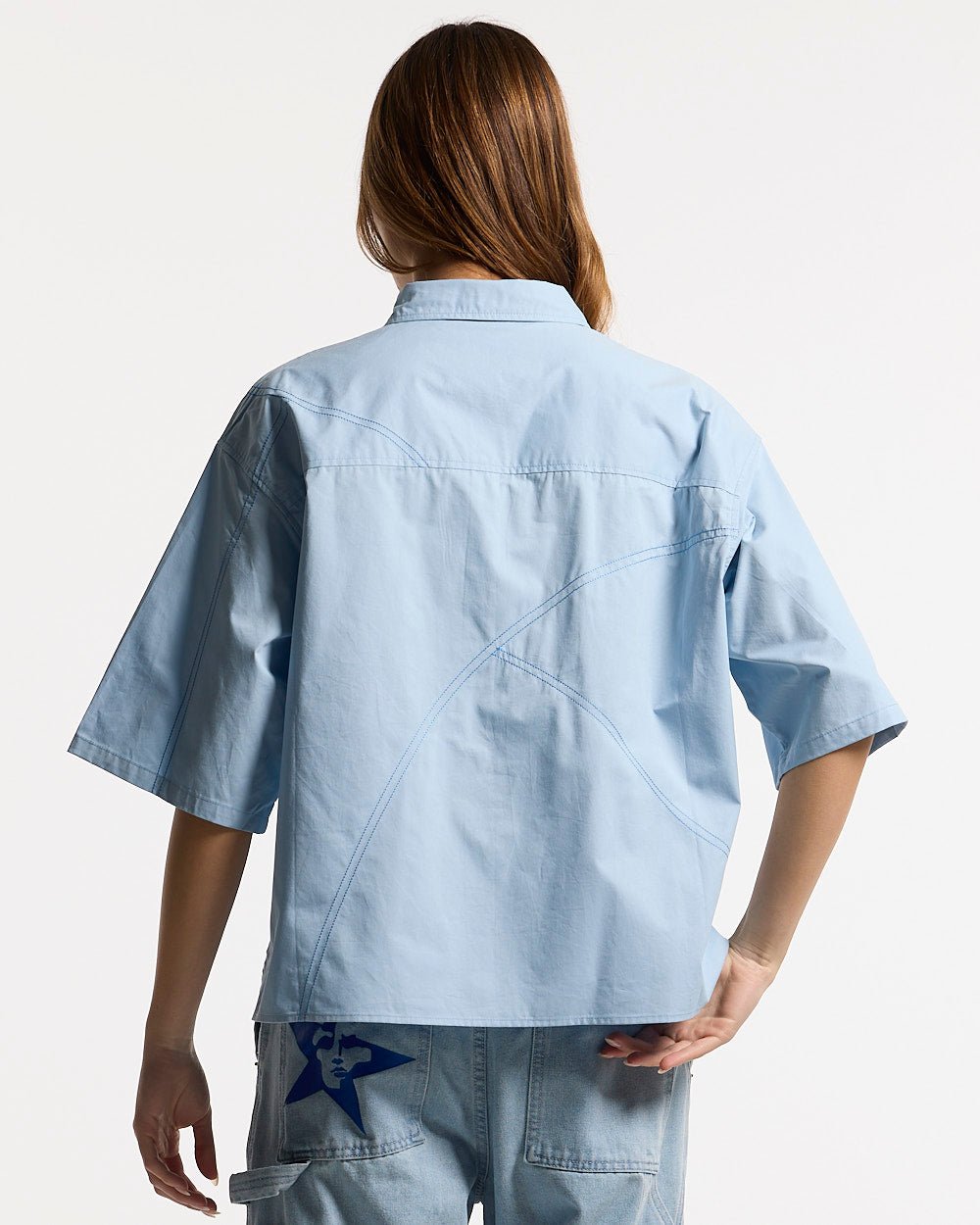 GUARDIAN SHIRT BREEZE BLUE - light blue short sleeve shirt, back view on female model - Cold Culture #woman