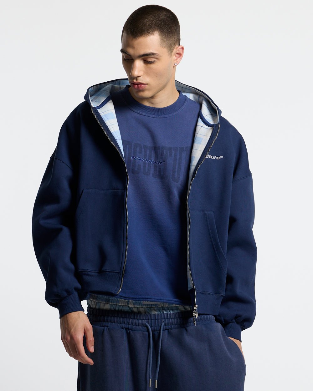 HIDE AND SEEK ZIP HOODIE NAVY - navy zip-up hoodie, front view on male model - Cold Culture #man