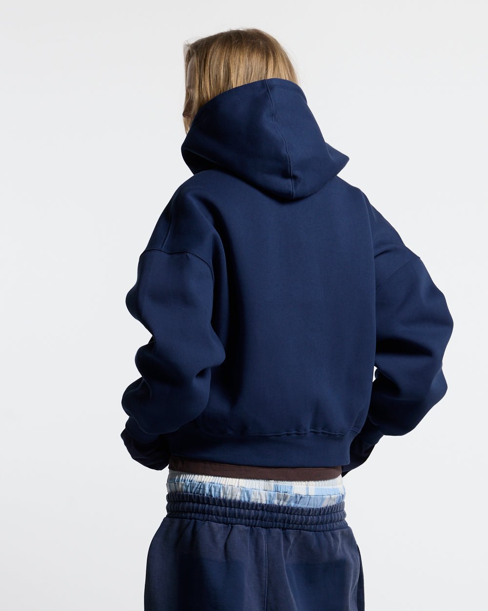 HIDE AND SEEK ZIP HOODIE NAVY - navy zip-up hoodie, back view on female model - Cold Culture #woman