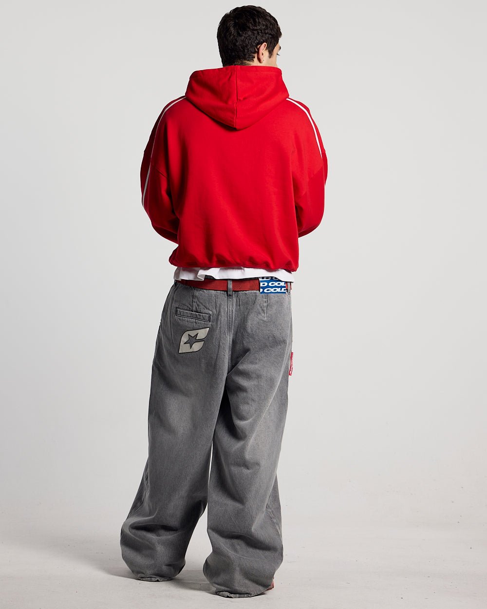 HIT THE TARGET HOODIE RED - red graphic print hoodie, back view on male model - Cold Culture