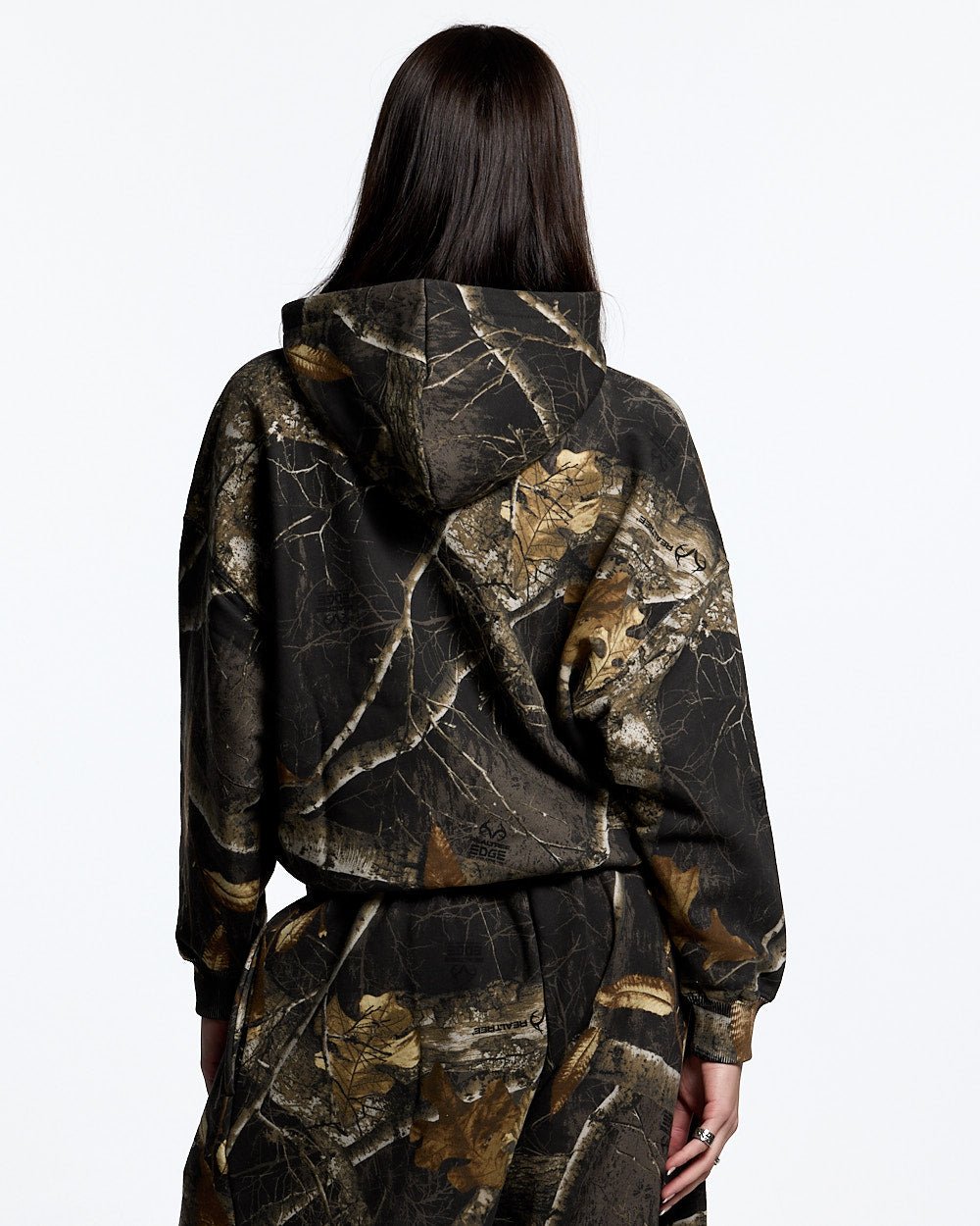 HOODIE REALTREE BLACK - black realtree camo hoodie, back view on female model - Cold Culture #woman