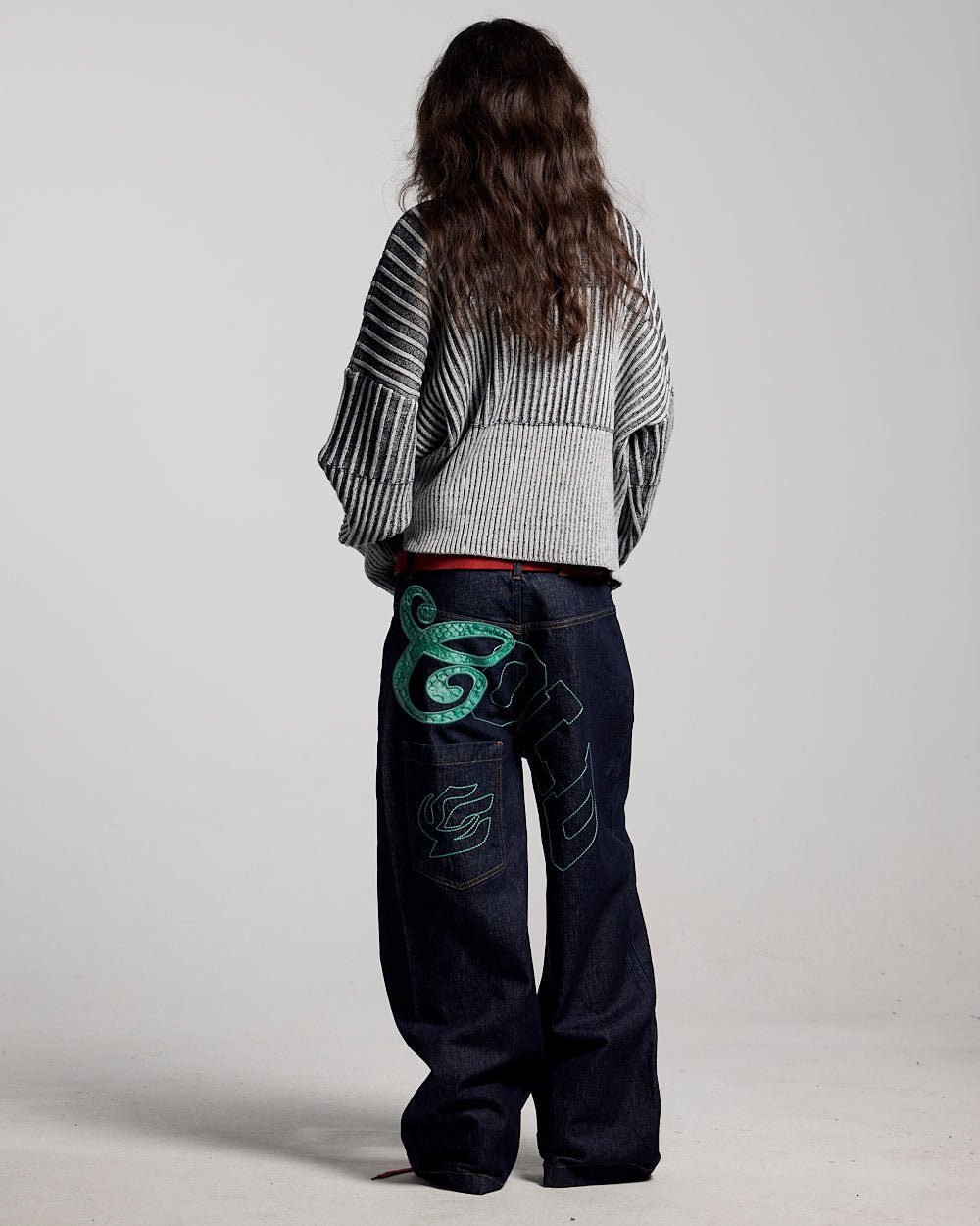 HYPERLINES KNIT BLACK & GREY - black and grey ribbed knit sweater, back view on female model - Cold Culture #woman