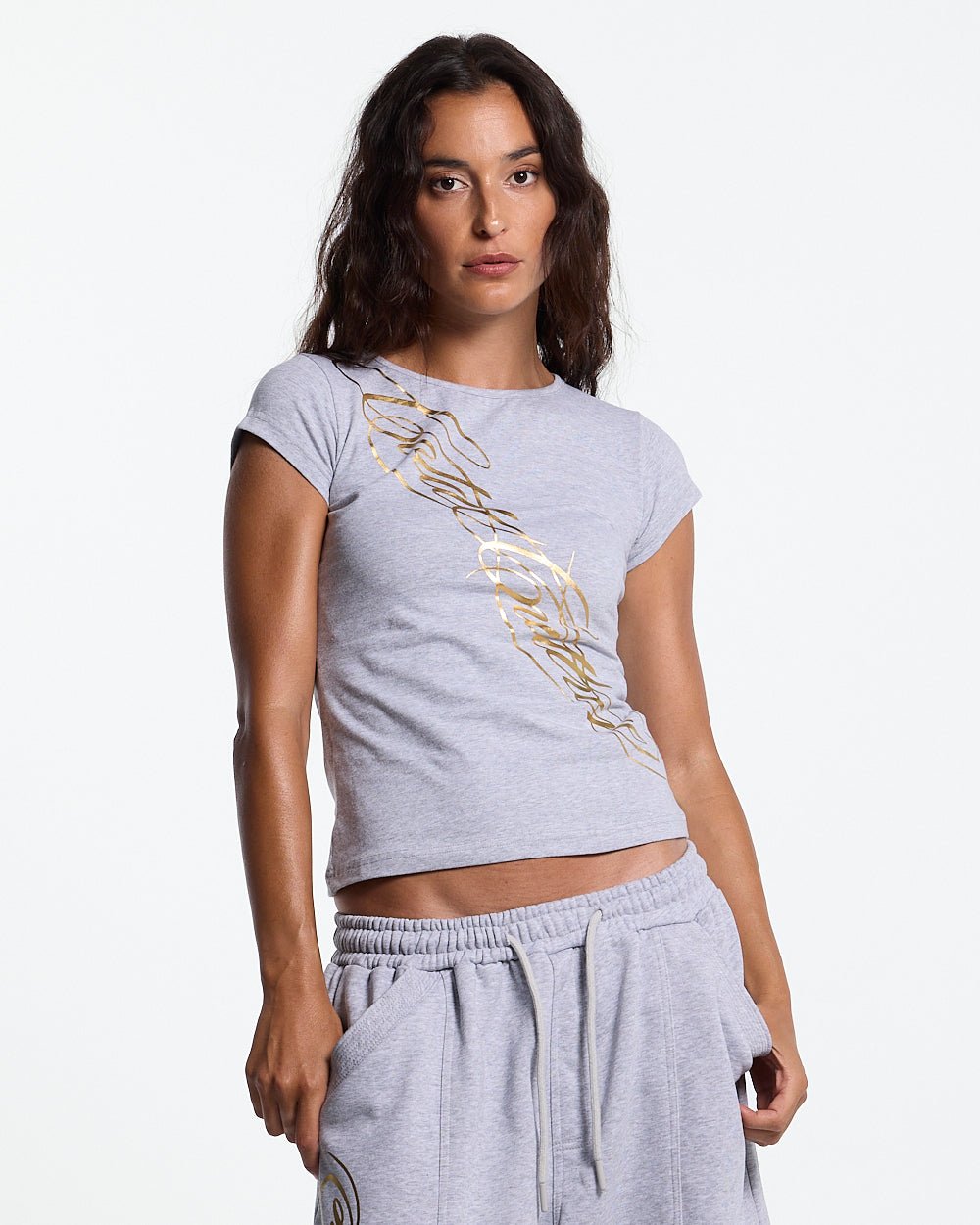 ICON BABY TEE HEATHER GREY - heather grey graphic print women's tee, front view on female model - Cold Culture #woman