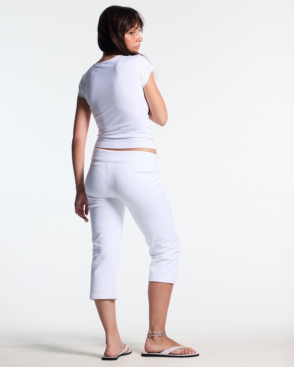 ICON BABY TEE WHITE - white graphic print women's tee, back view on female model - Cold Culture #woman