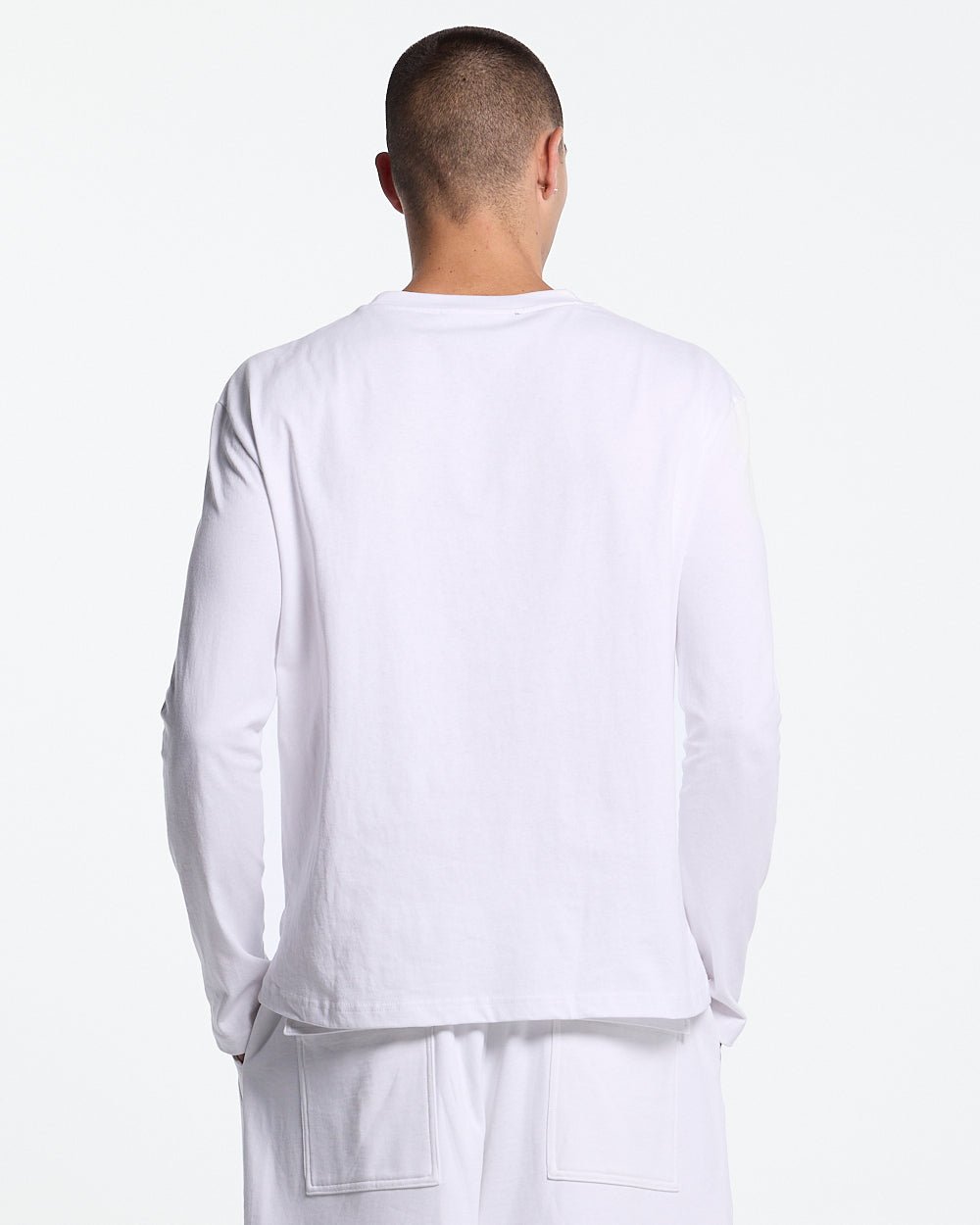 ICON LONGSLEEVE TEE WHITE - white graphic print longsleeve tee, back view on male model - Cold Culture #man