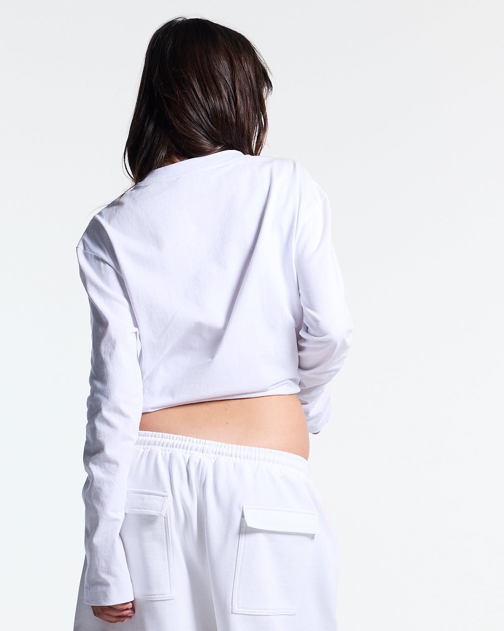 ICON LONGSLEEVE TEE WHITE - white graphic print longsleeve tee, back view on female model - Cold Culture #woman