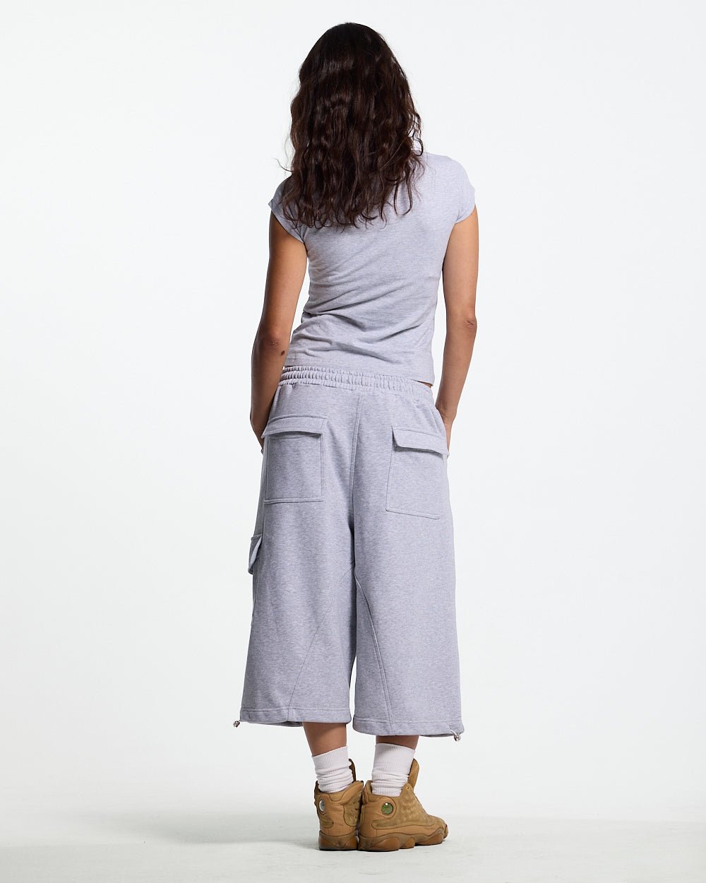 ICON SHORT HEATHER GREY - heather grey baggy shorts, back view on female model - Cold Culture #woman
