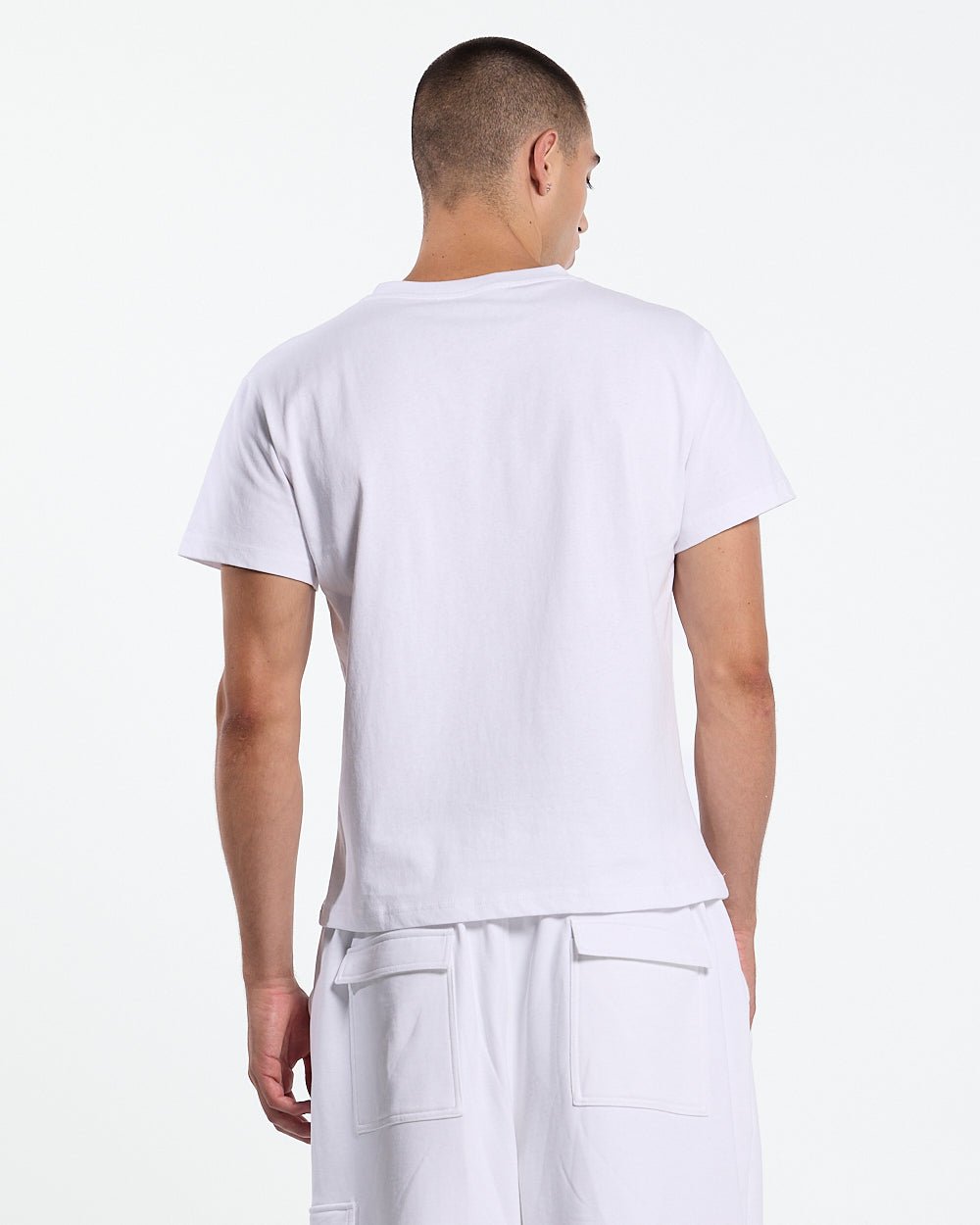 ICON TEE WHITE - white graphic print tee, back view on male model - Cold Culture #man