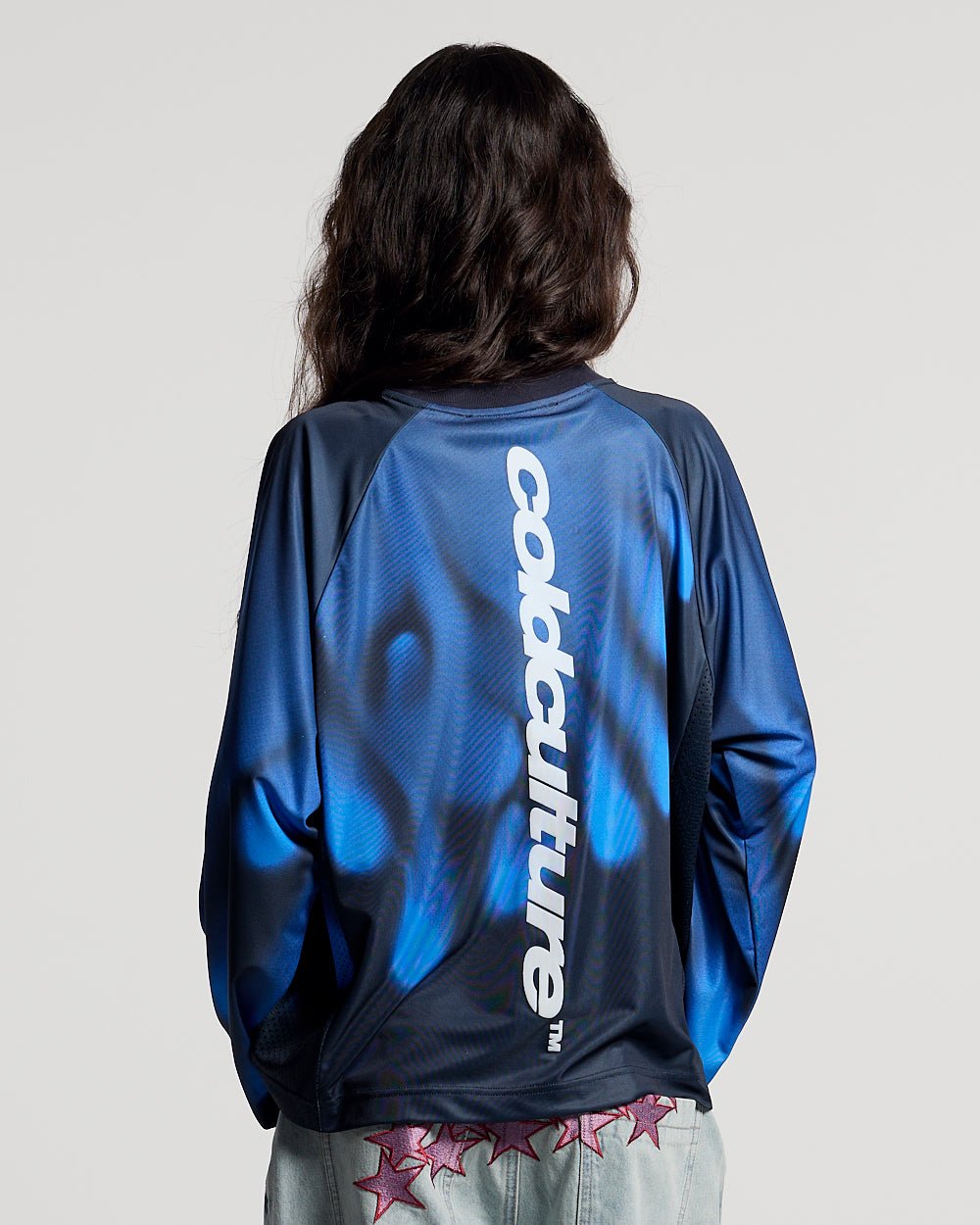 IGNITE LONGSLEEVE BLUE - blue printed longsleeve tee, back view on female model - Cold Culture #woman