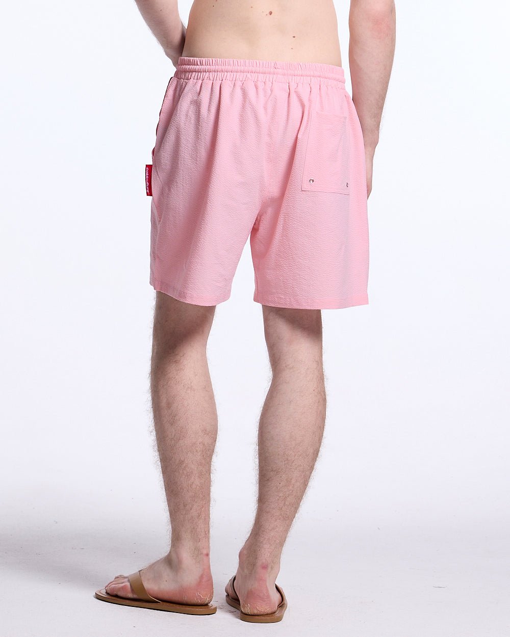 IMPACT SWIMWEAR PINK - pink printed swim shorts, back view on male model - Cold Culture
