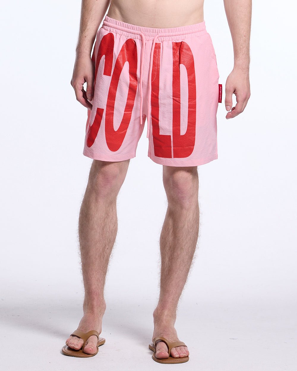 IMPACT SWIMWEAR PINK - pink printed swim shorts, front view on male model - Cold Culture