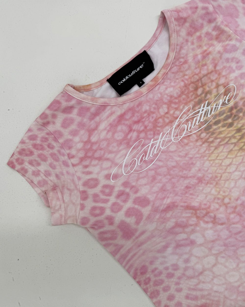 JAGUAR BABY TEE PINK - pink animal print baby tee, detail close-up - Cold Culture