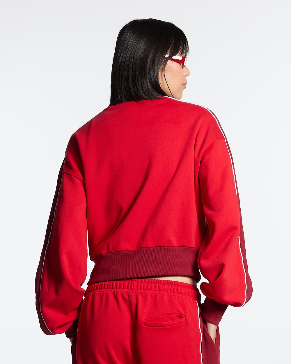 JET LAG JACKET RED - red and burgundy zip-up hoodie, back view on female model - Cold Culture #woman