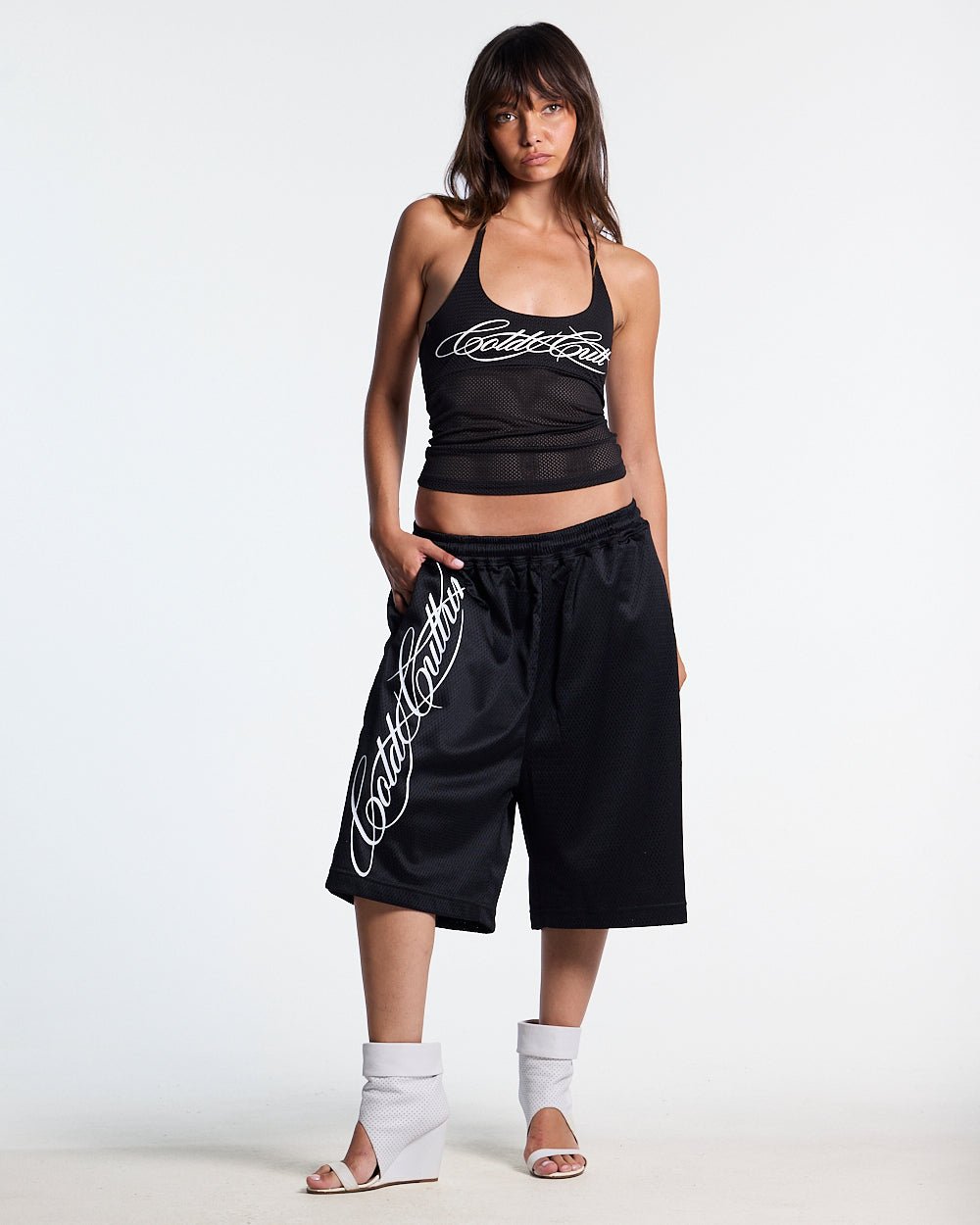 LADY C MESH TOP BLACK - black mesh halter top, front view on female model - Cold Culture #woman