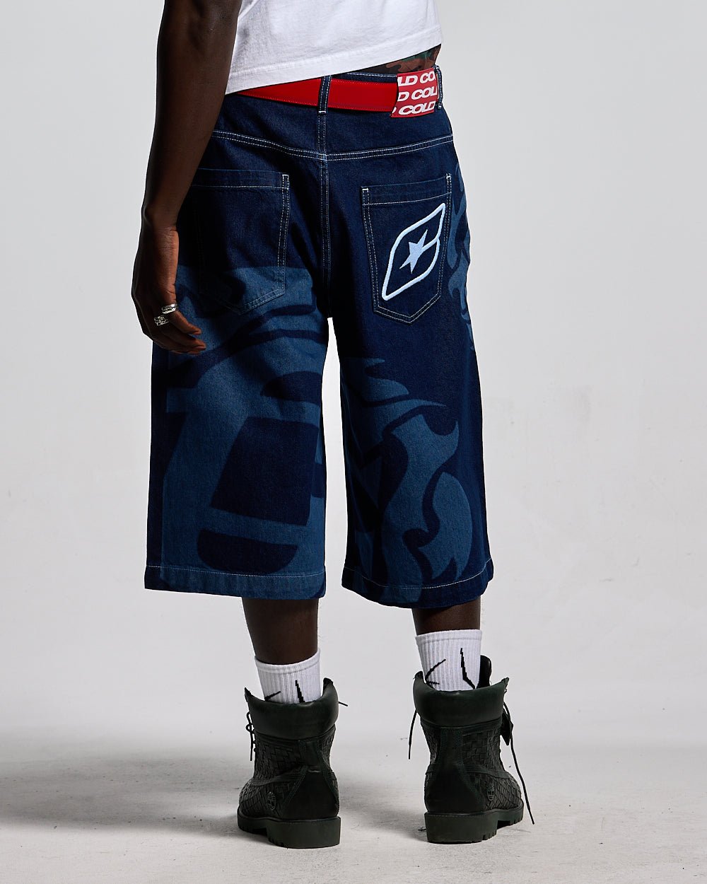 LASER DENIM BLUE JORTS - blue graphic print denim shorts, back view on male model - Cold Culture