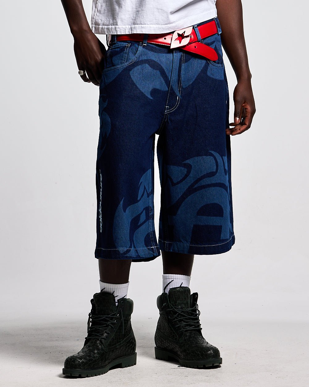 LASER DENIM BLUE JORTS - blue graphic print denim shorts, front view on male model - Cold Culture