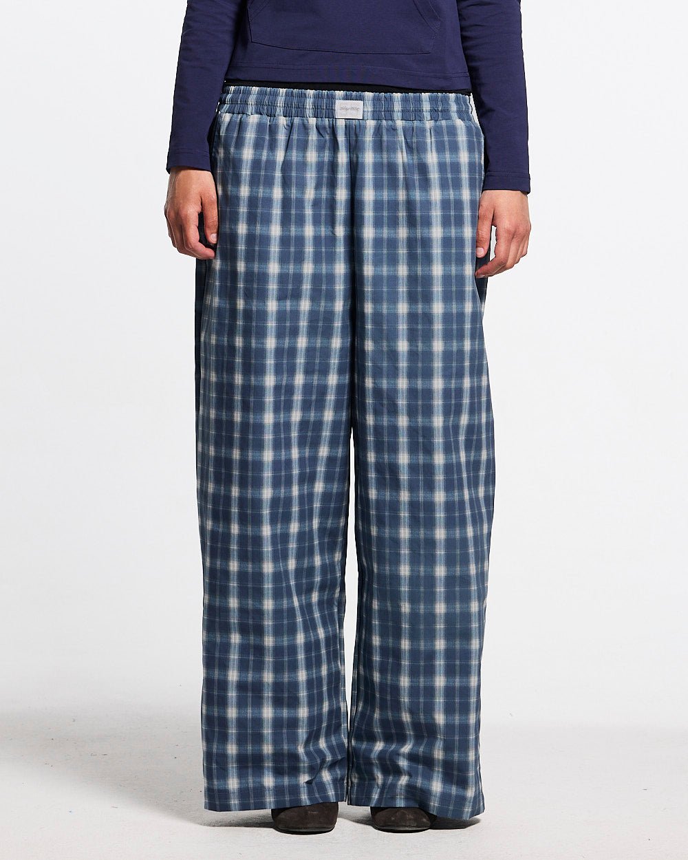 LIAR PANTS BLUE - blue plaid women's sweatpants, front view on female model - Cold Culture #woman