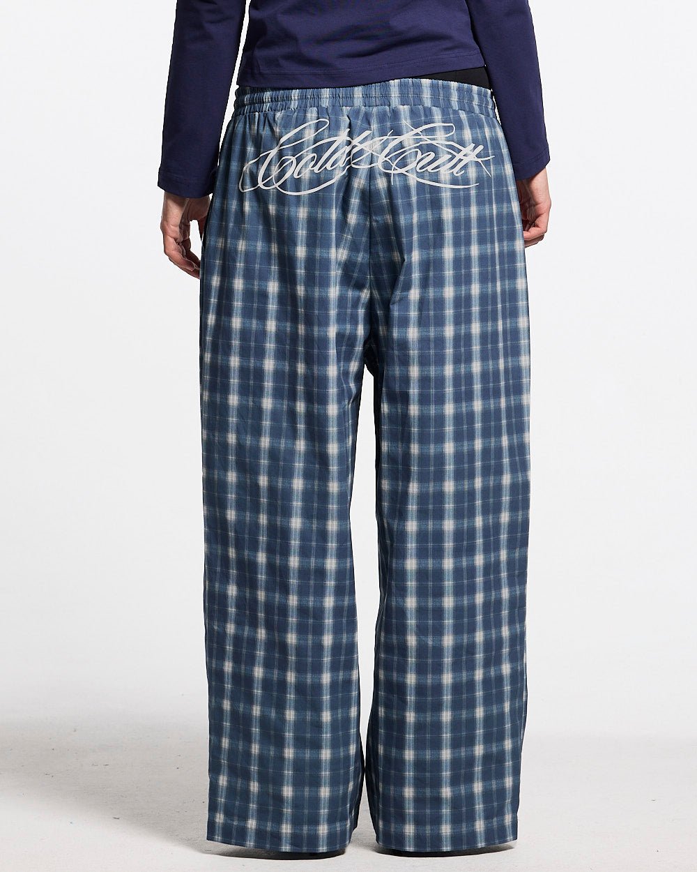 LIAR PANTS BLUE - blue plaid women's sweatpants, back view on female model - Cold Culture #woman