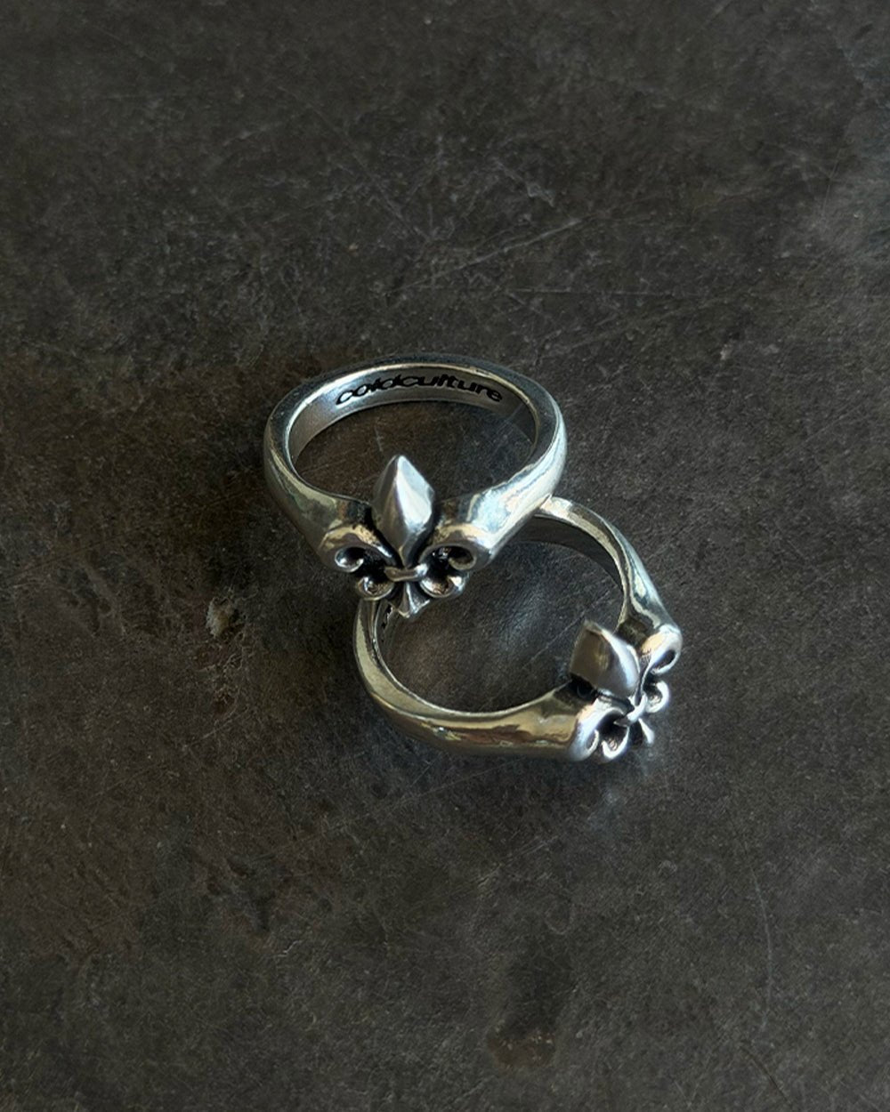 LIL ICON RING SILVER - silver fleur-de-lis ring, flat lay - Cold Culture