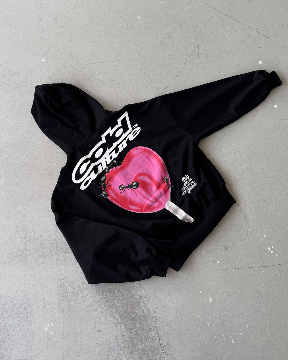 LOLLIPOP ZIP HOODIE BLACK - black graphic print zip-up hoodie, flat lay - Cold Culture