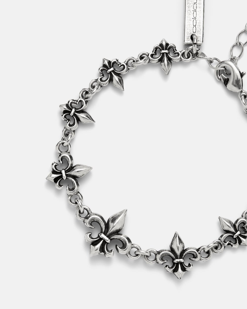 LOOSE ICON BRACELET SILVER - silver fleur-de-lis chain bracelet, detail close-up - Cold Culture