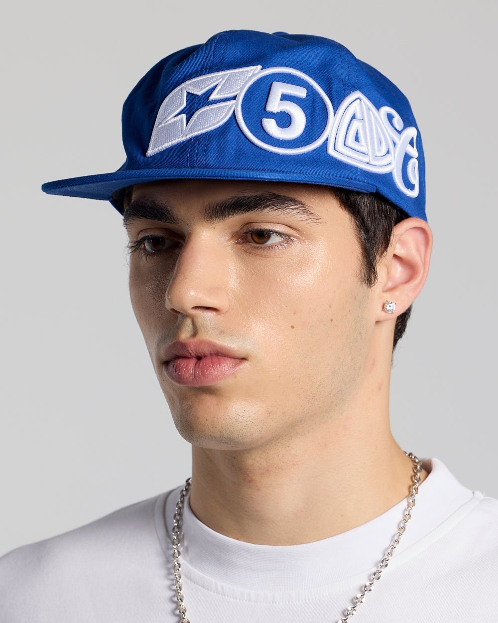 MEETING CAP DARK BLUE - royal blue embroidered cap, on model close-up - Cold Culture #man