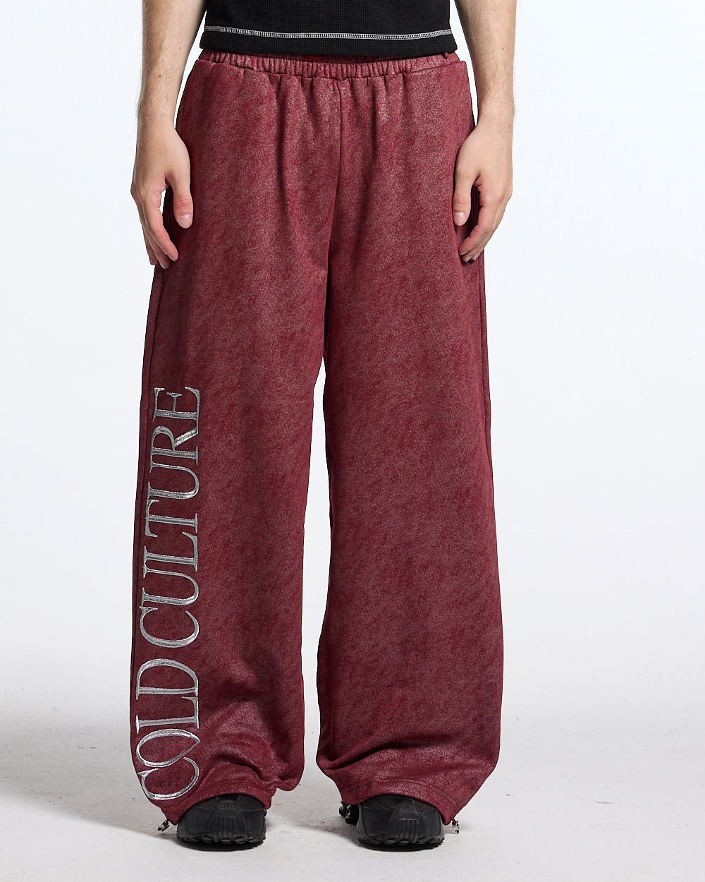 MERRY SWEATPANTS RED - washed red sweatpants, front view on male model - Cold Culture